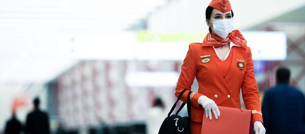 Стюардесса авиакомпании Аэрофлот в аэропорту Шереметьево в Москве Стюардесса авиакомпании Аэрофлот в аэропорту Шереметьево в Москве - Sputnik Moldova-România