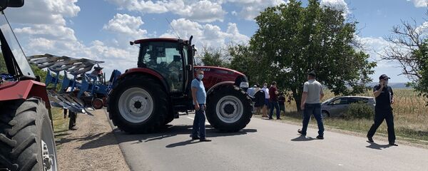 Protestatarii au blocat drumul național Chișinău-Căușeni Protestatarii au blocat drumul național Chișinău-Căușeni - Sputnik Moldova