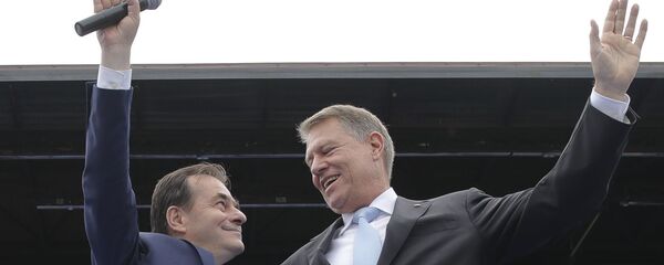 Klaus Iohannis și Ludovic Orban Klaus Iohannis și Ludovic Orban - Sputnik Moldova-România