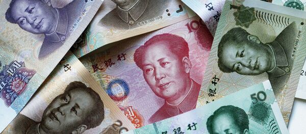 Китайские денежные купюры-юани. - Sputnik Молдова