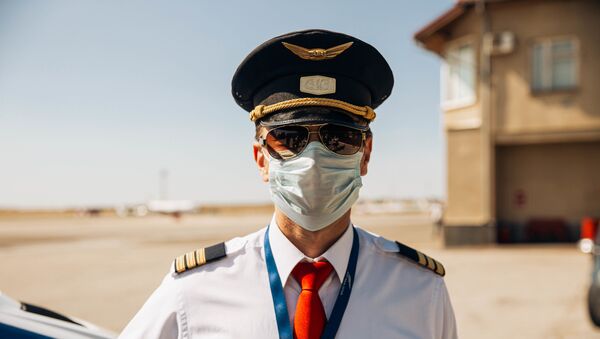 În contextul pandemiei, piloții sunt obligați să poarte mască  - Sputnik Moldova