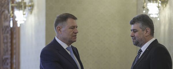 Klaus Iohannis și Marcel Ciolacu Klaus Iohannis și Marcel Ciolacu - Sputnik Moldova-România