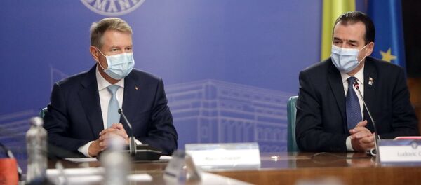 Klaus Iohannis și Ludovic Orban - Sputnik Moldova-România