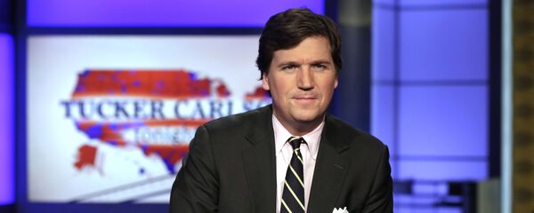 FILE - In this March 2, 2017, file photo, Tucker Carlson, host of Tucker Carlson Tonight, poses for photos in a Fox News Channel studio in New York FILE - In this March 2, 2017, file photo, Tucker Carlson, host of Tucker Carlson Tonight, poses for photos in a Fox News Channel studio in New York - Sputnik Moldova-România