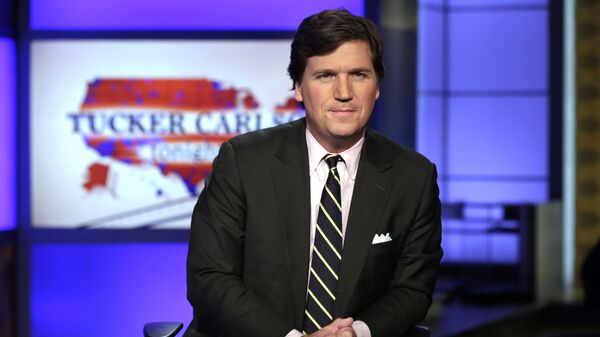 FILE - In this March 2, 2017, file photo, Tucker Carlson, host of Tucker Carlson Tonight, poses for photos in a Fox News Channel studio in New York - Sputnik Moldova