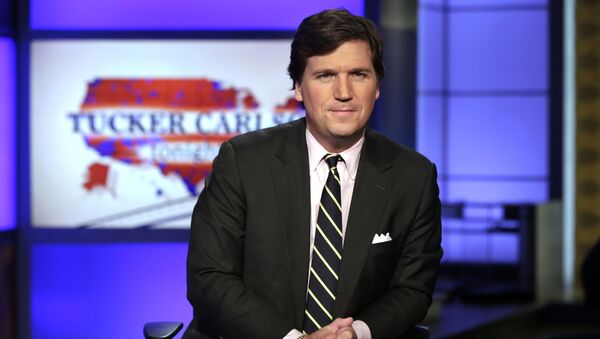 FILE - In this March 2, 2017, file photo, Tucker Carlson, host of Tucker Carlson Tonight, poses for photos in a Fox News Channel studio in New York - Sputnik Moldova-România