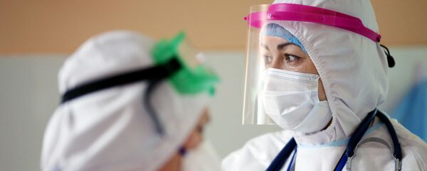 Медицинские работники в инфекционной больнице Медицинские работники в инфекционной больнице - Sputnik Молдова