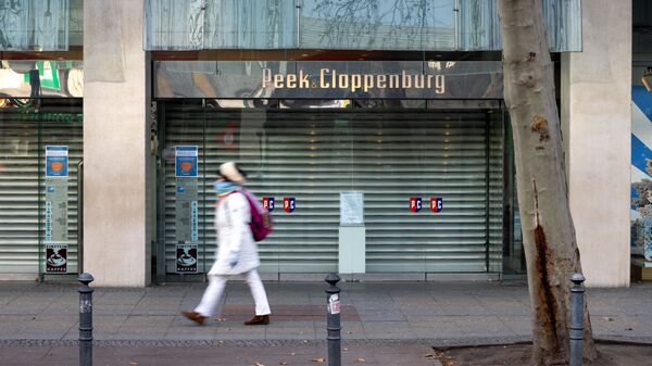 Закрытый магазин на улице Тауэнциенштрассе в Берлине во время общенационального локдауна в Германии - Sputnik Moldova-România