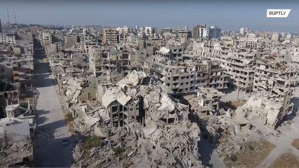 Беспилотник заснял разрушенный Хомс в десятую годовщину начала войны в Сирии - Sputnik Молдова