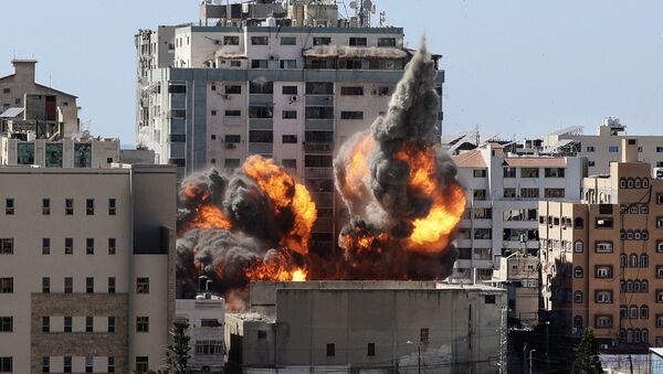 ВВС Израиля нанесли авиаудары по высотке в Газе, в которой расположены офисы американского информагентства Associated Press и катарского телеканала «Аль-Джазира» - Sputnik Moldova-România