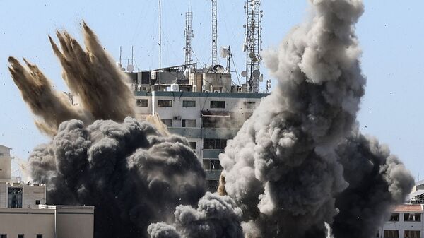 ВВС Израиля уничтожили высотку в Газе, в которой находились офисы американского информагентства Associated Press и катарского телеканала Al Jazeera - Sputnik Moldova