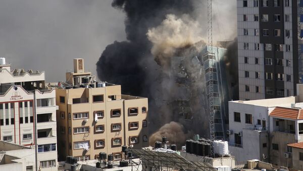 ВВС Израиля уничтожили высотку в Газе, в которой находились офисы американского информагентства Associated Press и катарского телеканала Al Jazeera - Sputnik Moldova