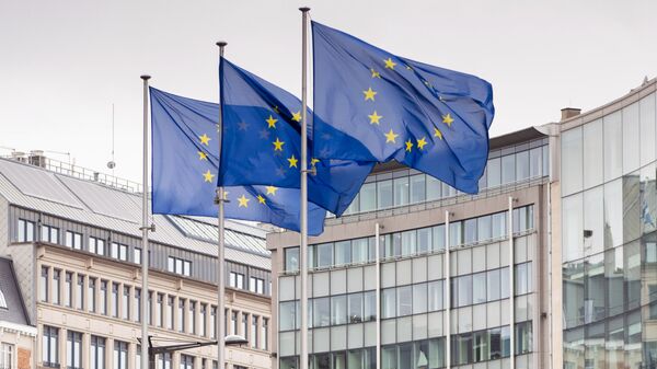 European Union flags flap in the wind as two gardeners work on the outside of EU headquarters in Brussels, Wednesday, Sept. 11, 2019.  - Sputnik Moldova-România