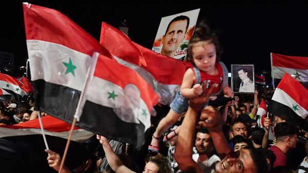 Празднование победы Башара Асада на президентских выборах в Сирии - Sputnik Moldova