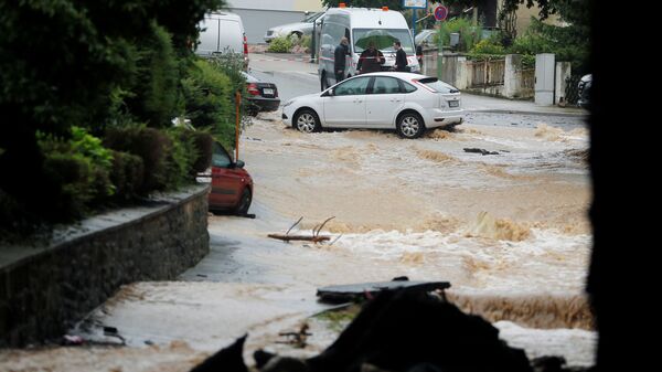 Затопленная улица после проливных дождей в Хагене, Германия  - Sputnik Молдова