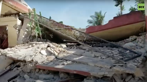 Страна в руинах: число жертв землетрясения на Гаити возросло почти до 1,3 тыс. человек
 - Sputnik Молдова