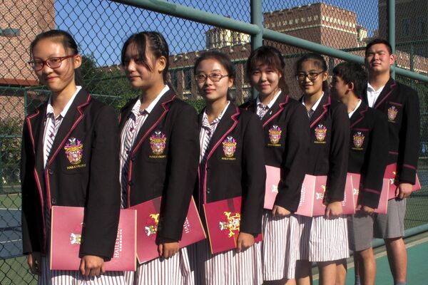 Fotografie făcută în data de 31 august 2016: studenți chinezi se pregătesc de deschiderea oficială a anului școlar. - Sputnik Moldova