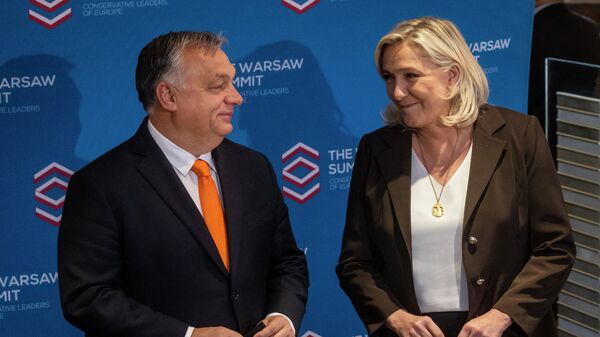 Marine Le Pen și premierul Ungariei, Victor Orban - Sputnik Moldova-România