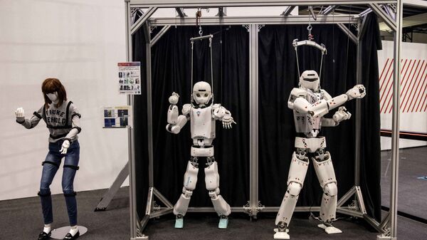 Роботы Kawasaki humanoid на Международной выставке роботов в Токио - Sputnik Молдова