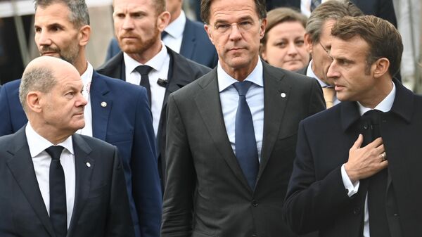 Канцлер ФРГ Олаф Шольц, премьер-министр Нидерландов Марк Рютте и президент Франции Эмманюэль Макрон - Sputnik Молдова