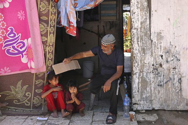 Семейные посиделки и жаркая погода в Газе. - Sputnik Молдова