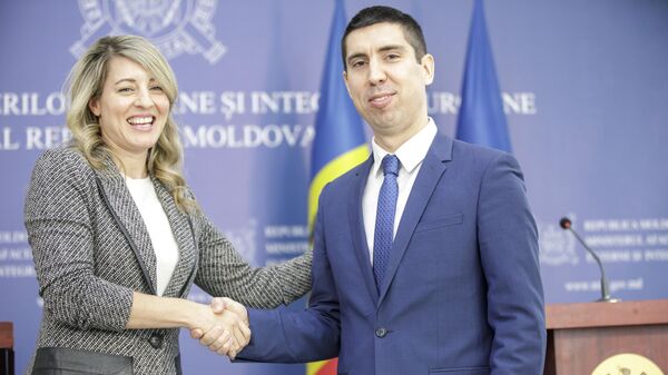 Канада пообещала Молдове $2 миллиона для поддержки полиции и санкции против дезинформации - Sputnik Молдова