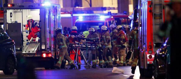 Police and emergency workers at the site of an attack at a Christmas market in Berlin. Police and emergency workers at the site of an attack at a Christmas market in Berlin. - Sputnik Молдова