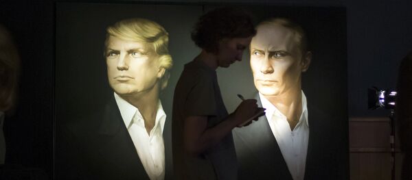 A journalist writes a material as she watches a live telecast of the U.S. presidential election standing at portraits of U.S. presidential candidate Donald Trump and Russian President Vladimir Putin in the Union Jack pub in Moscow, Russia, Wednesday, Nov. 9, 2016 - Sputnik Moldova-România