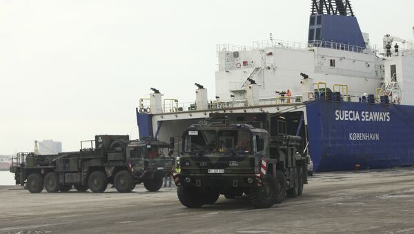 German military trucks carrying NATO's Patriot Missile Defense System to protect Turkey in case neighboring Syria launches an attack leave the port after the parts of system were unloaded in the Mediterranean city of Iskenderun, Turkey, Monday, Jan. 21, 2013 - Sputnik Moldova-România