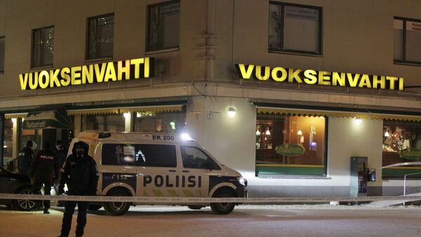 Police guards the area were three people were killed in a shooting incident at a restaurant in Imatra, Eastern Finland after midnight on December 4, 2016 - Sputnik Moldova-România