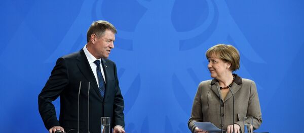 Klaus Iohannis, Angela Merkel - Sputnik Moldova-România