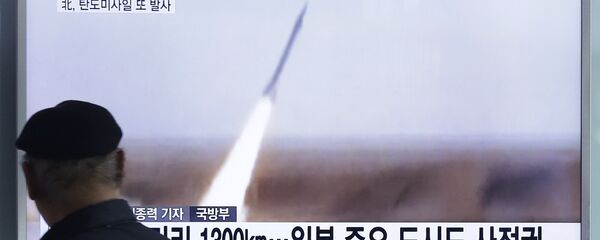 A man watches a TV screen showing a file footage of the missile launch conducted by North Korea, at Seoul Railway Station in Seoul, South Korea, Friday, March 18, 2016 - Sputnik Moldova