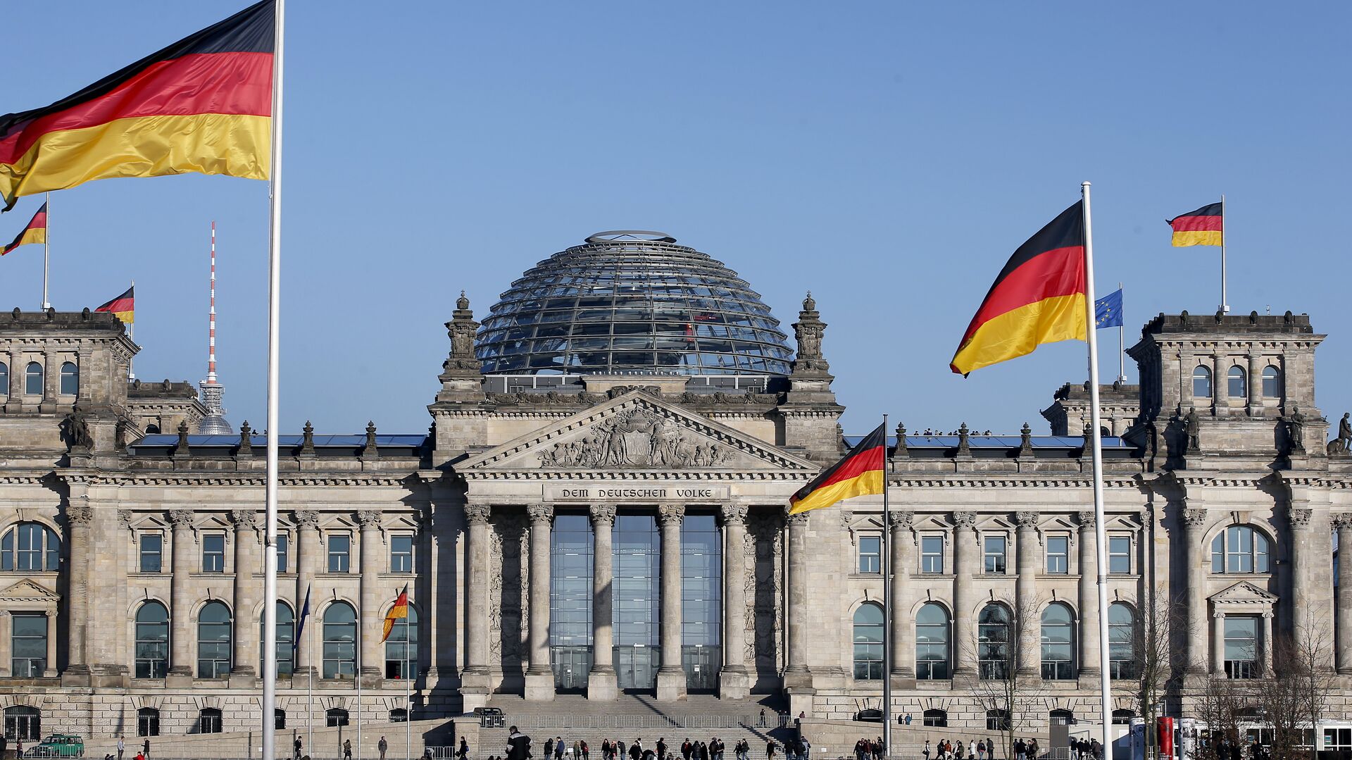 German flags wave in front of the Reichstag building, host of the German Federal Parliament Bundestag, in Berlin, Germany. (File) - Sputnik Moldova-România, 1920, 07.03.2022