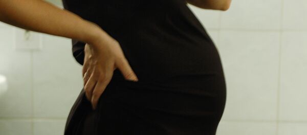 Беременная женщина. Архивное фото - Sputnik Moldova-România