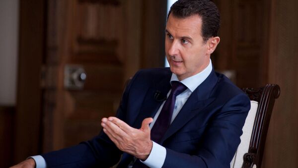 In this photo released on July 1, 2016, by the Syrian official news agency SANA, Syrian President Bashar Assad speaks during an interview with Australia's SBS news channel, in Damascus, Syria - Sputnik Moldova-România
