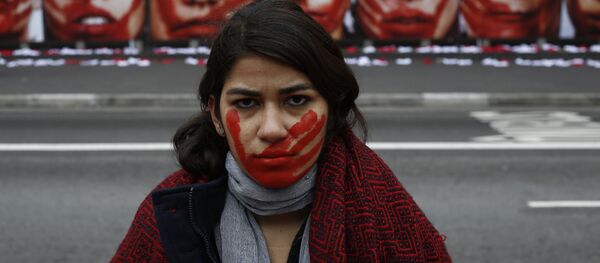 A member of the NGO Rio de Paz poses during an exhibit demonstration against violence against women, displaying some 420 panties and portraits of bloodstained women, in Paulista Avenue in Sao Paulo, Brazil on June 10, 2016. - Sputnik Moldova