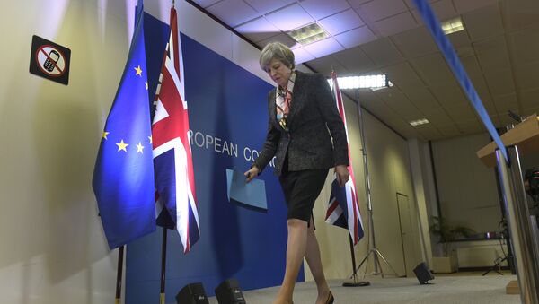 British Prime Minister Theresa May leaves after a press conference during a European Summit at the EU headquarters in Brussels on March 9, 2017 - Sputnik Moldova