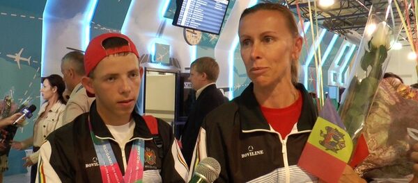 Участник Всемирных игр Special Olympics из Молдовы Павел Иванов и тренер Ольга Косык - Sputnik Молдова