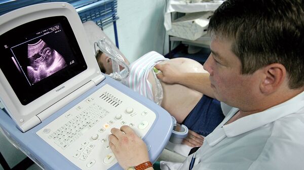 Gravidă la un control medical, imagine din arhivă - Sputnik Moldova