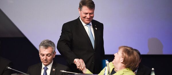 Klaus Iohannis și Angela Merkel la Congresul PPE din Malta Klaus Iohannis și Angela Merkel la Congresul PPE din Malta - Sputnik Moldova-România