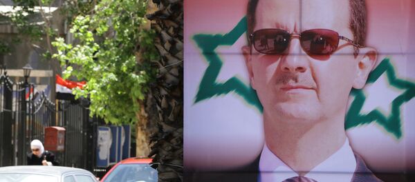 Poster bearing a portrait of President Bashar al-Assad Poster bearing a portrait of President Bashar al-Assad - Sputnik Moldova-România
