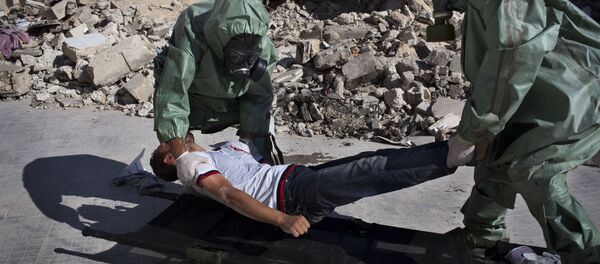Volunteers take part in a simulation of how to respond to a chemical attack, in the northern Syrian city of Aleppo (File) - Sputnik Moldova-România