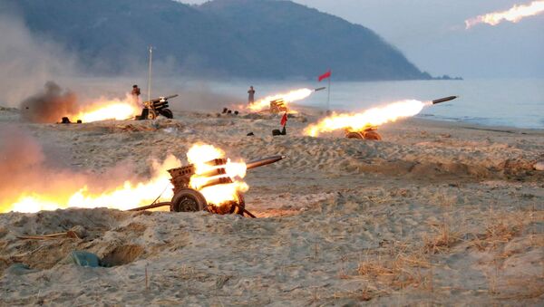 A view of a firing contest among multiple launch rocket system (MLRS) batteries selected from large combined units of the KPA, in this undated photo released by North Korea's Korean Central News Agency (KCNA) in Pyongyang - Sputnik Moldova-România