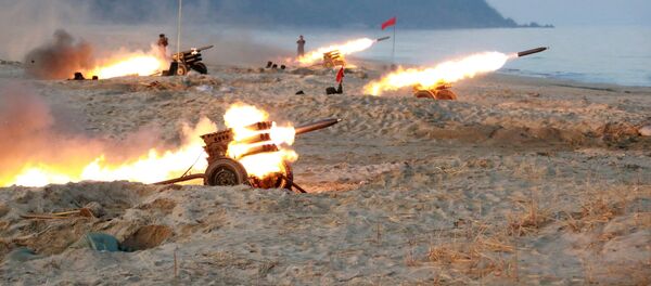A view of a firing contest among multiple launch rocket system (MLRS) batteries selected from large combined units of the KPA, in this undated photo released by North Korea's Korean Central News Agency (KCNA) in Pyongyang - Sputnik Moldova-România