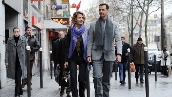 Președintele sirian Bashar al-Assad împreună cu soția sa Asma Assad - Sputnik Moldova-România