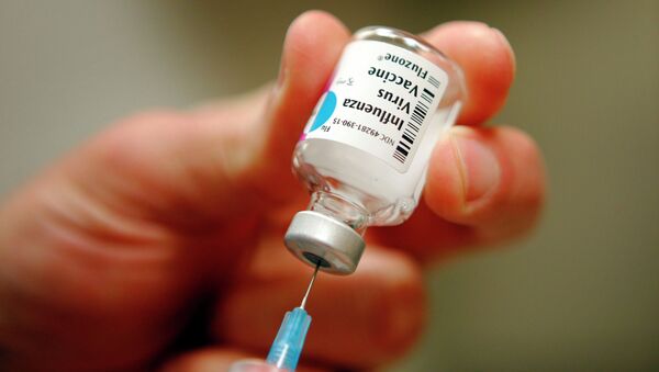 A nurse prepares an injection of the influenza vaccine at Massachusetts General Hospital - Sputnik Moldova-România
