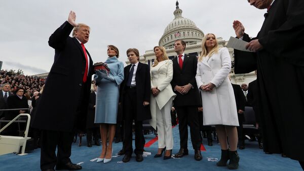 U.S. President Donald Trump takes the oath of office as his wife Melania holds the bible and his children Barron, Ivanka, Eric and Tiffany watch as U.S. Supreme Court Chief Justice John Roberts (R) administers the oath during inauguration ceremonies swearing in Trump as the 45th president of the United States on the West front of the U.S. Capitol in Washington, DC, U.S., January 20, 2017 - Sputnik Moldova-România