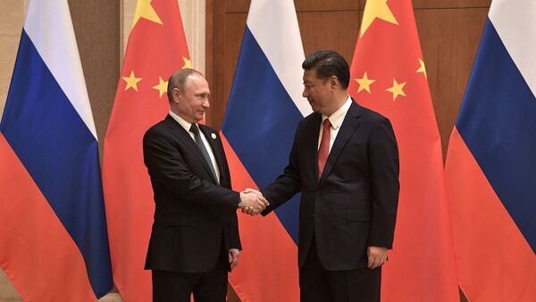 President Vladimir Putin and President of China Xi Jinping, right, during the Russia-China talks at the One Belt, One Road international forum - Sputnik Moldova-România