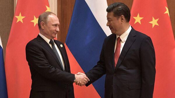 President Vladimir Putin and President of China Xi Jinping, right, during the Russia-China talks at the One Belt, One Road international forum - Sputnik Moldova-România
