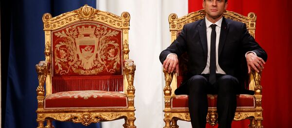 French President Emmanuel Macron listens as Paris Mayor Anne Hidalgo delivers her speech during a ceremony at the Hotel de Ville in Paris, France, May 14, 2017. - Sputnik Moldova